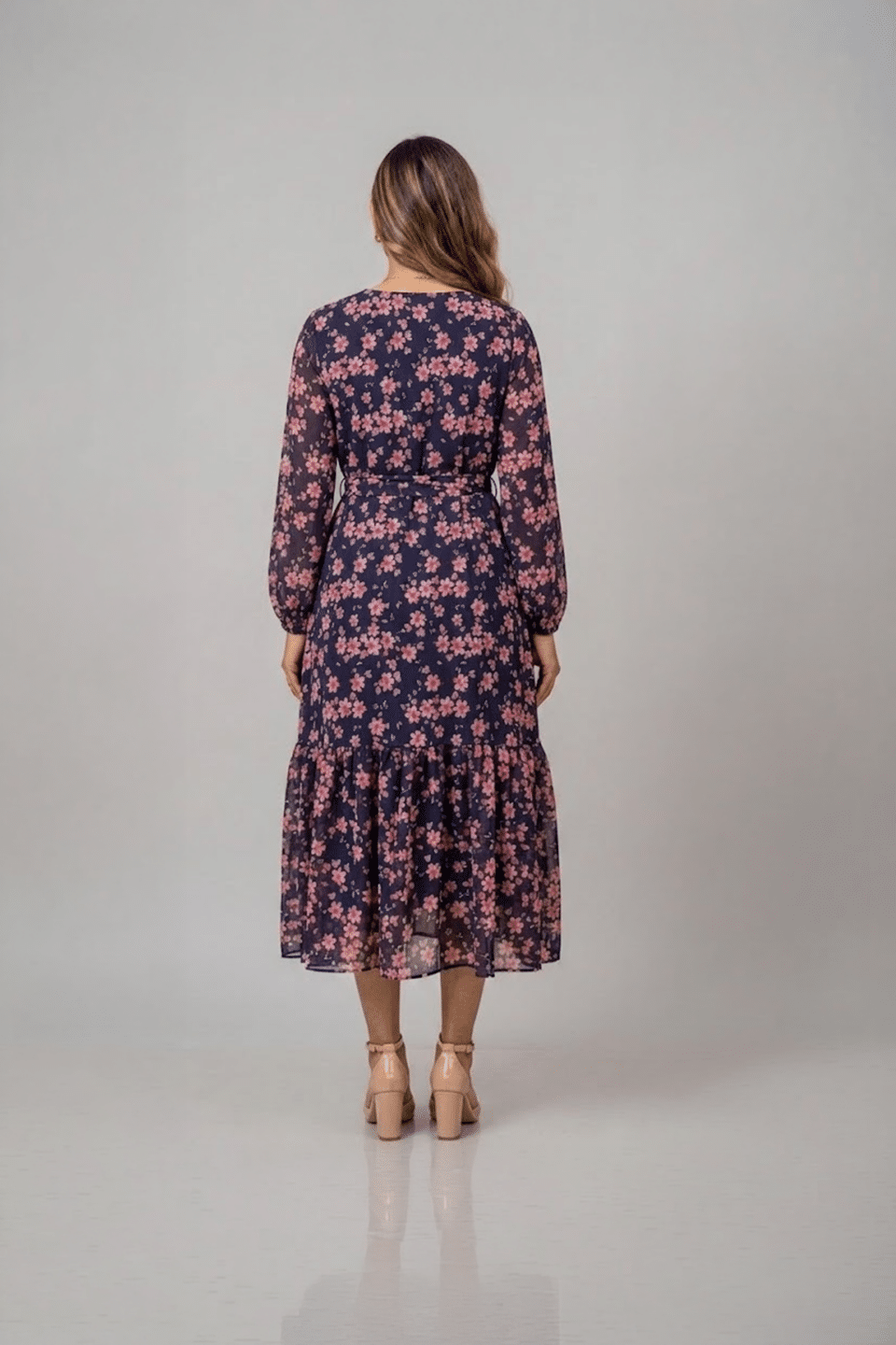 Navy blue floral ruffle midi dress with pink flower print, long sleeves and a tie-up waist