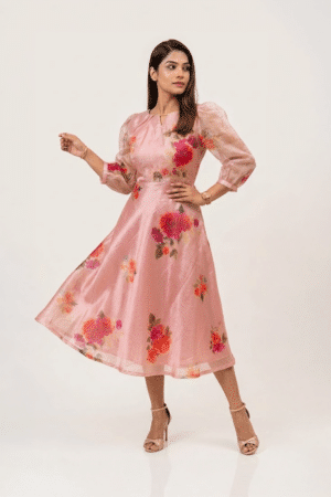 Woman wearing a Blossom Breeze Party Wear midi dress with three-quarter puff sleeves and an A-line silhouette