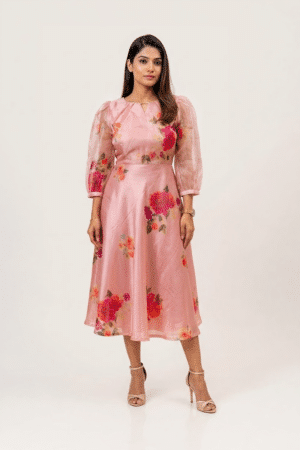 Woman wearing a Blossom Breeze Party Wear midi dress with three-quarter puff sleeves and an A-line silhouette