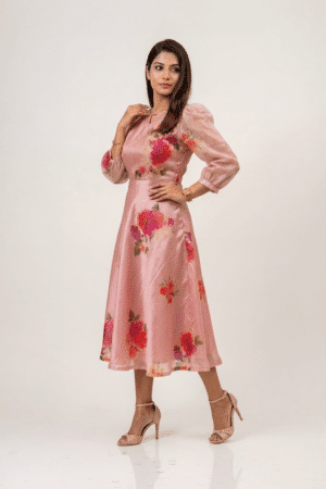 Woman wearing a Blossom Breeze Party Wear midi dress with three-quarter puff sleeves and an A-line silhouette
