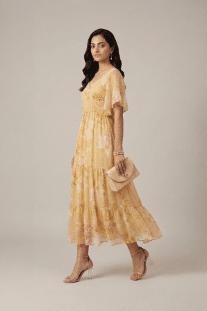 Pastel yellow floral tiered maxi dress with flutter sleeves