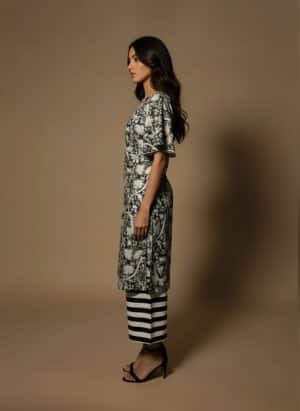 Black and white kurta set with flared sleeves, side view