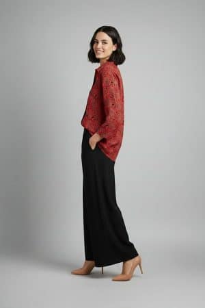 Woman wearing red printed co-ord set with wide-leg pants