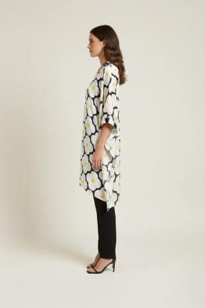 Black and white floral satin kaftan with yellow accents, side view