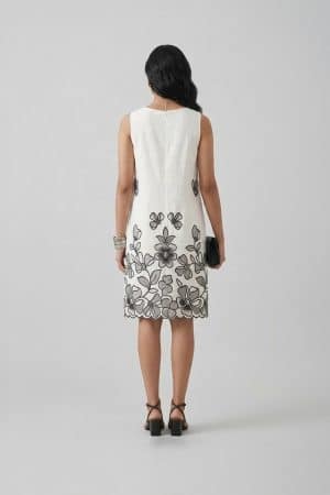 Ivory sleeveless A-line dress with black floral embroidery