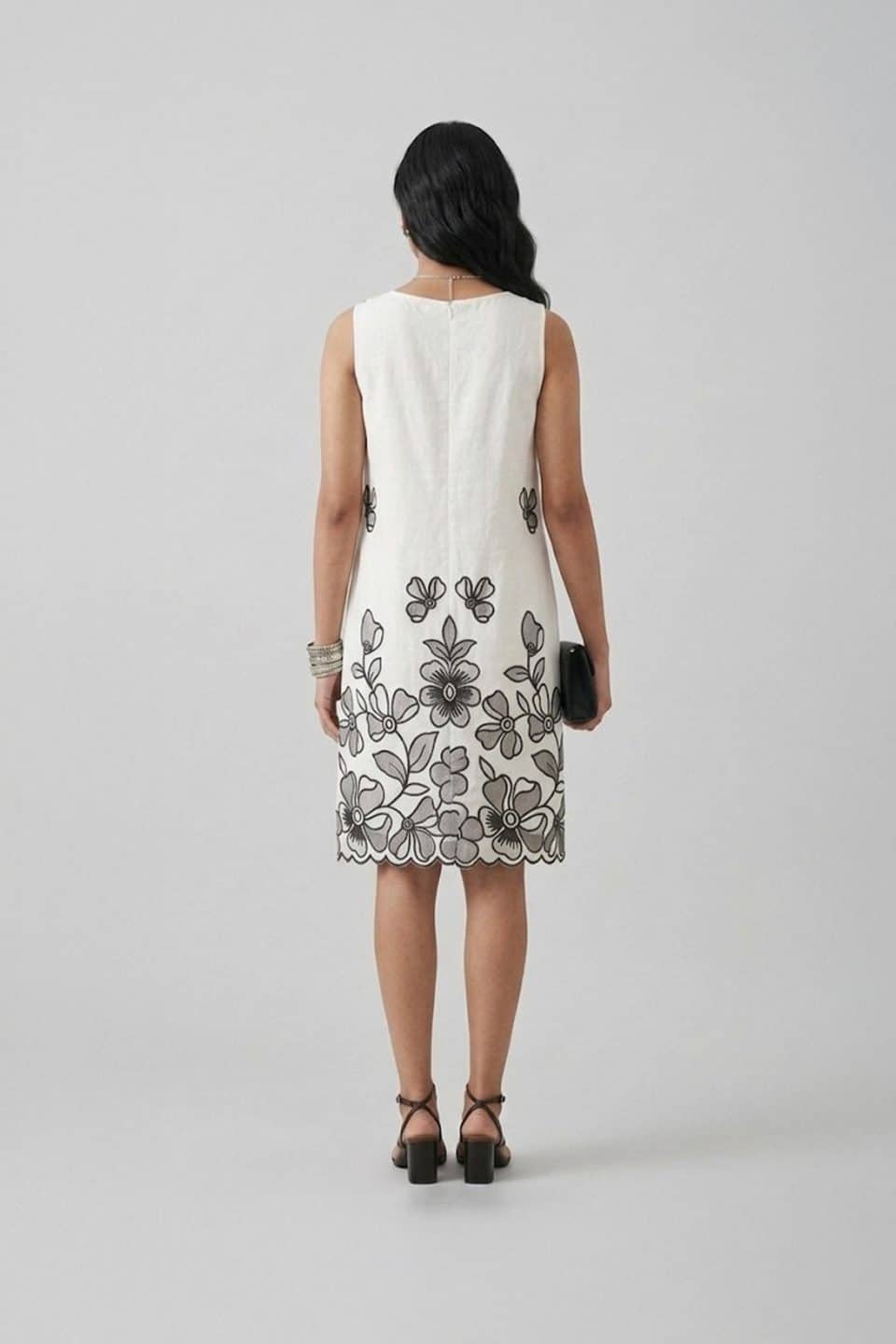 Ivory sleeveless A-line dress with black floral embroidery