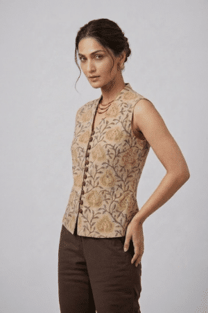 Mustard Floral Sleeveless Top with button-down front and brown trousers