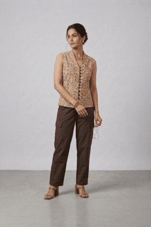 Mustard Floral Sleeveless Top with button-down front and brown trousers
