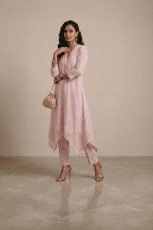 pink kurta set for women with asymmetrical hem and pants