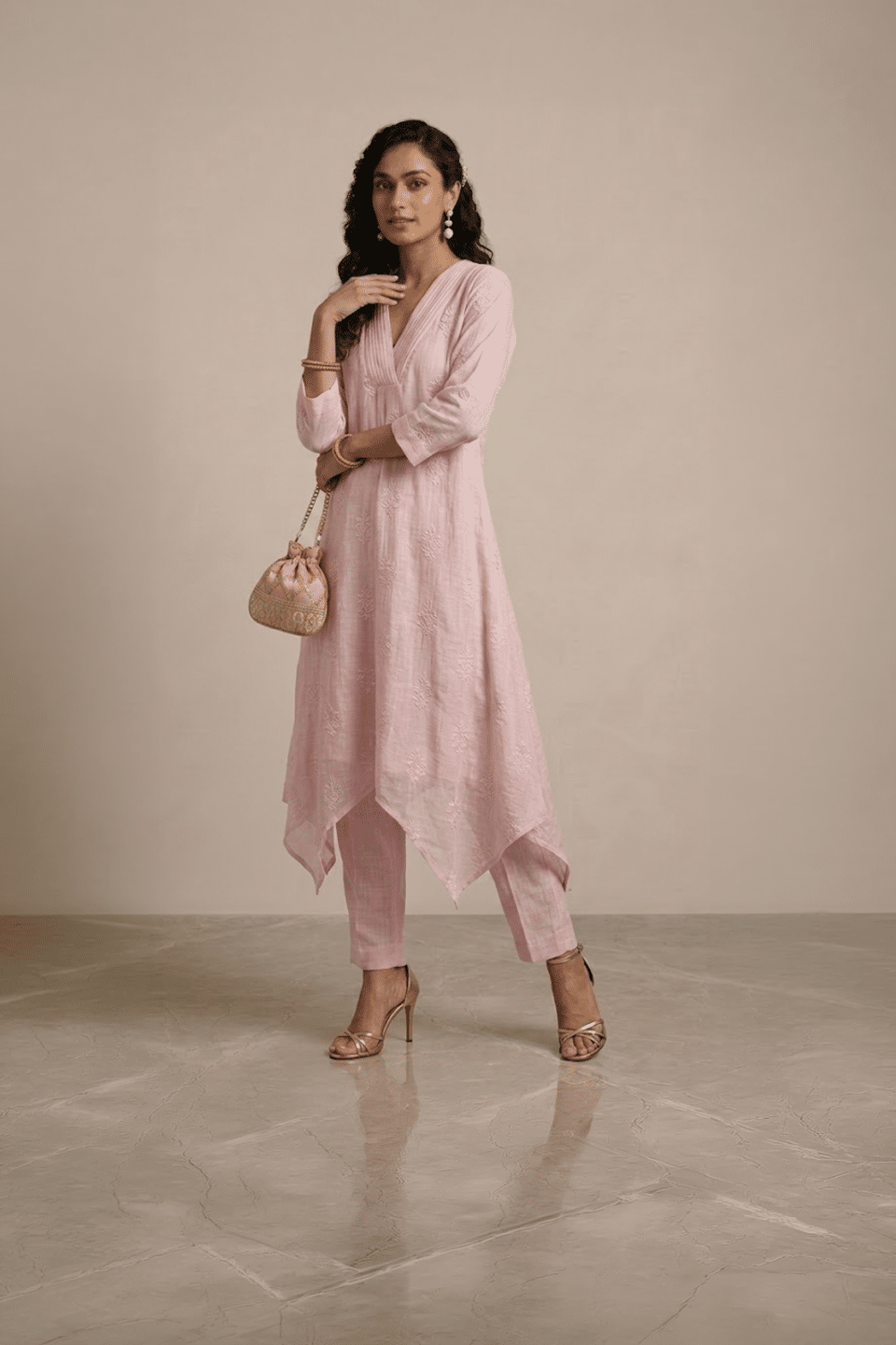 pink kurta set for women with asymmetrical hem and pants