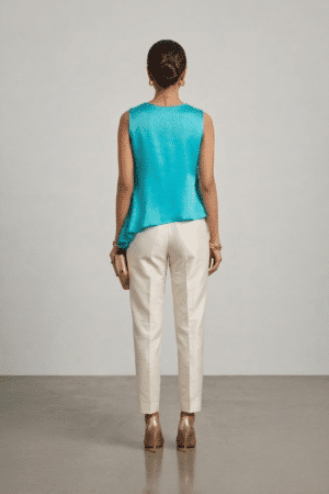 Turquoise sleeveless top with layered asymmetric hem