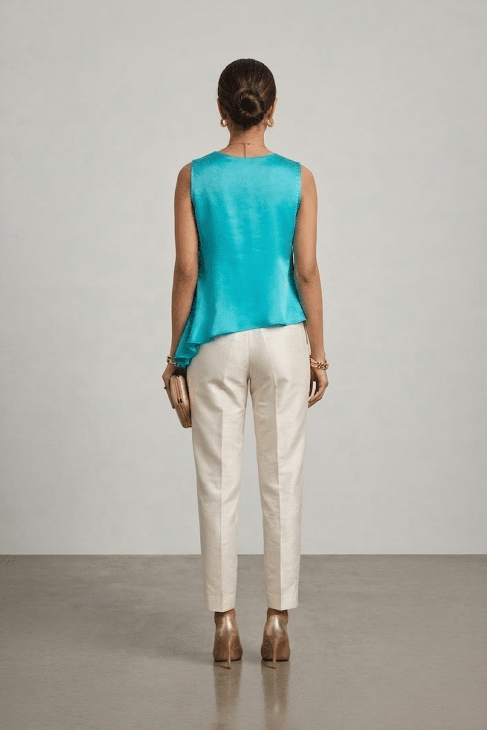 Turquoise sleeveless top with layered asymmetric hem
